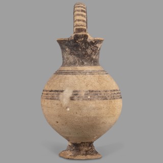 Jug, Jug on a ring-shaped foot, from which a low, wide stem extends, transitioning into a belly.