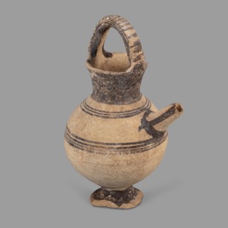 Jug, Jug on a ring-shaped foot with a low, wide stem leading to a belly. Upper part of the