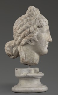 Head of the goddess Aphrodite; creator, Greek sculpture, female portrait; hair tied in a bow at the