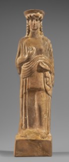 Figurine of a woman with a polos on her head, Tanagra workshop, early 5th century BC circa 480 BC,