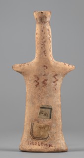 Female idol, Female idol with arms marked as appendages. On a long, cylindrical neck is a nose and