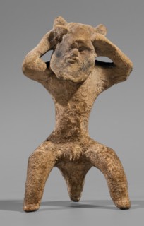 Satyr figurine. Clay figurine depicting a satyr with a face stylized as a mask with protruding ears