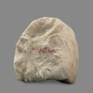 Head of a woman wearing a veil. The face is oval with regular features: rounded chin, small compact