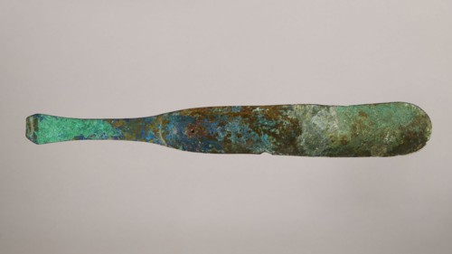 Scraper, metal scraper with a typical slightly curved shape consisting of a handle and a blade with