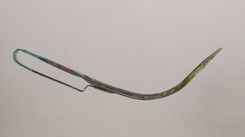 Scraper, metal scraper with a typical, slightly curved shape consisting of a handle and a blade