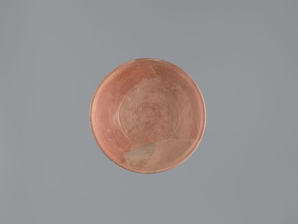 Plate, unknown Aswan workshop; flat plate on a low, ring-shaped foot. Rim poorly defined, rounded