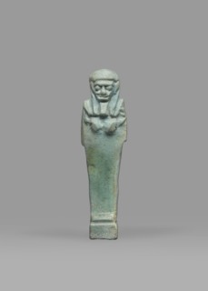 Ushabti, Mummy-shaped funerary figurine shabti, standing on a base, back supported by a