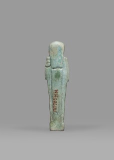 Ushabti, Mummy-shaped funerary figurine shabti, standing on a base, back supported by a