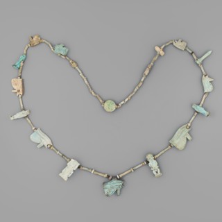 Necklace with amulets, udjat eyes, tit knots, Ptah the dwarf, Toeris, necklaces, columns, auletes
