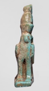 Amulet of Horus in the form of a falcon sitting on a rectangular base with a double crown on its