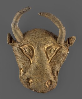 Protoma bull head relief mask, A bull's head in the form of a relief mask made using the repoussé