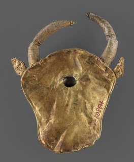 Protoma; bull's head relief mask in gold, made using repoussé with granulation and filigree.