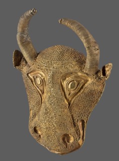 Protoma; bull's head relief mask made in gold using repoussé, filigree, and granulation. Central