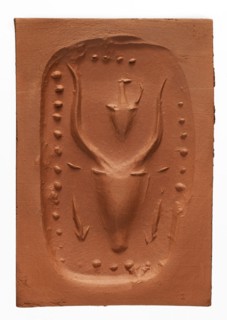 Stamp seal with a depiction of a bull's head, unknown Cypriot workshop. Stamp seal with a full,