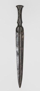 Dagger, unknown Luristan workshop. A dagger with a blade cast together with a mushroom-shaped hilt,