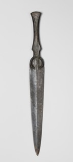 Dagger, unknown Luristan workshop. Short dagger with a blade cast together with a mushroom-shaped