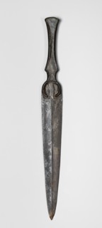 Dagger, unknown Luristan workshop. Short dagger with a blade cast together with a mushroom-shaped