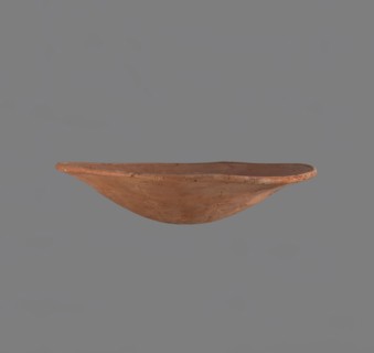 Bowl. Low bowl with irregular, strongly flaring walls and a rounded bottom. Rounded rim, slightly