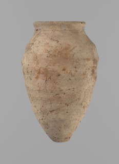 Vessel with hieratic inscription. Conical clay vessel tapering to a pointed bottom; irregular,