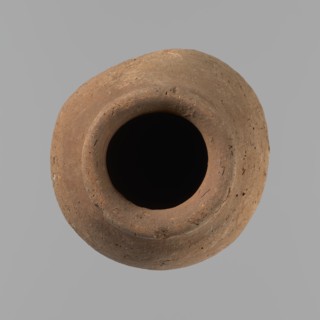 Vessel with hieratic inscription. Conical clay vessel tapering toward the bottom; irregular, widest