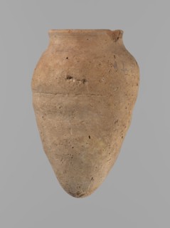 Vessel with hieratic inscription. Conical clay vessel tapering toward the bottom, irregular, widest