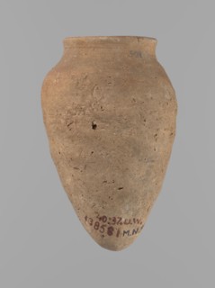 Vessel with hieratic inscription. Conical clay vessel tapering toward a pointed bottom; irregular