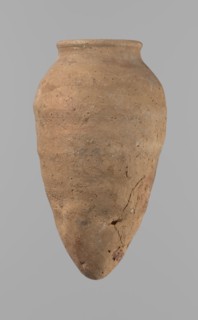 Vessel with hieratic inscription. Hand-made clay vessel, turned in the upper part neck, spout.