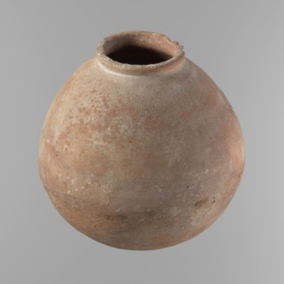 Vessel with an almost spherical belly, widest about 1/3 of the vessel's height. Sloping shoulders.