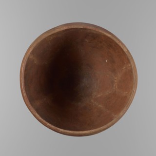 Bowl. Large conical clay vessel, rounded bottom, straight slightly tapering spout; widest about 4/5