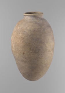 Vessel with an ovoid belly, widest about halfway up. Wide, short, almost cylindrical neck. Rounded,