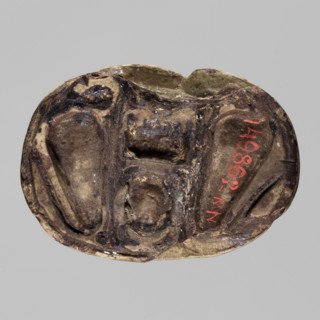 Scarab with the name Menkheperre. Scarab amulet with a decorated top engraved with a cartouche