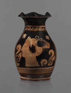 Red-figure oinochoe. Oinochoe with a flat foot separated by a ring, an oval belly, and sloping