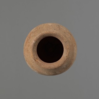 Vessel by, Egyptian pottery ceramic conical vessel tapering toward the bottom, irregular, widest