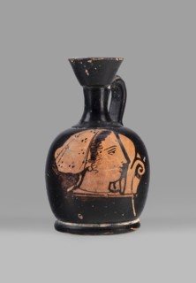Aryballus lekythos with a depiction of a woman's head in a cap, ca. 400 BC, Attica, vessel