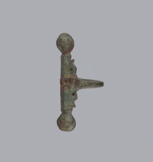 Onion-shaped fibula, Italy. A fibula with a hinged structure featuring an arched ring formed from a