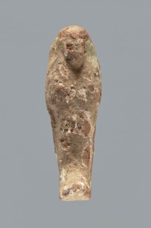 Ushabti. A mummy-shaped ushabti figurine made of clay, impressed in a mold. Traces of white primer
