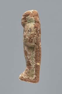 Ushabti. A mummy-shaped ushabti figurine made of clay, impressed in a mold. Traces of white primer