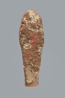 Ushabti. A mummy-shaped ushabti figurine made of clay, impressed in a mold. Traces of white primer