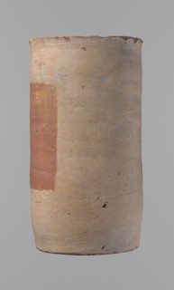 Canopic urn, clay, cylindrical shape with flat bottom and flat straight rim. Made on the wheel from