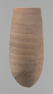 Vessel with a conical shape and a pointed bottom. Straight, tapering rim. Made on the wheel of Nile