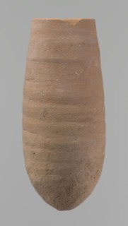 Vessel with a conical shape and a pointed bottom. Straight, tapering rim. Made on the wheel of Nile