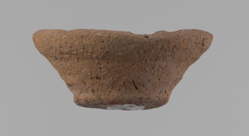 Bowl, probably votive, conical shape with flat bottom. Irregular walls; straight, slightly flaring