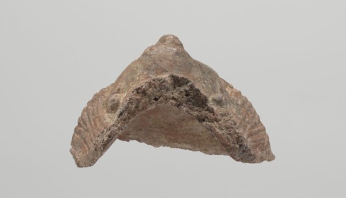 Female votive head, Female head with long, straight hair falling to the shoulders. Neck partially