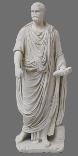 Roman statue, unknown Roman workshop. The figure of a standing man dressed in a tunic and toga,
