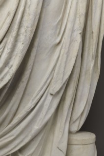 Roman statue, unknown Roman workshop. Figure of a striding man dressed in a tunic and toga. The