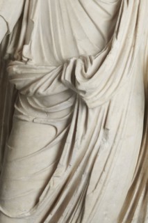 Roman statue, unknown Roman workshop. Figure of a striding man dressed in a tunic and toga. The