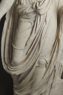 Roman statue, unknown Roman workshop. Figure of a striding man dressed in a tunic and toga. The