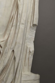Roman statue, unknown Roman workshop. Figure of a striding man dressed in a tunic and toga. The