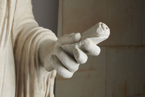 Roman statue, unknown Roman workshop. Figure of a striding man dressed in a tunic and toga. The