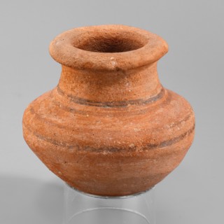 Vessel, A small wheel-made clay vessel with an almost hemispherical belly that transitions halfway